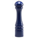 A cobalt blue ceramic salt shaker with a silver top.