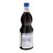 A close-up of a black Fabbri Amarena Cherry Mixybar syrup bottle with a label.
