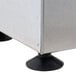 A stainless steel food wrap cutter box with black suction cups on the bottom.