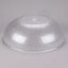A clear plastic pebbled serving bowl.