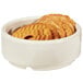A stack of ivory melamine ramekins filled with crackers.