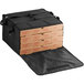 A black Choice insulated pizza delivery bag with pizza boxes inside.