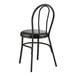 A Lancaster Table & Seating black metal hairpin chair with a black vinyl seat.