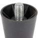 A black metal cylinder with a silver bolt on the end.