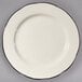 A CAC ivory china plate with scalloped edges and a black rim.