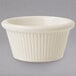 A white fluted melamine ramekin.