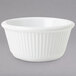 A white fluted melamine ramekin.