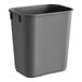 A grey plastic rectangular wastebasket.