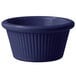 A cobalt blue fluted melamine ramekin.