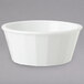 A white GET fluted plastic ramekin on a grey surface.