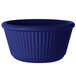 A cobalt blue fluted melamine ramekin.