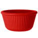 A red fluted melamine ramekin.
