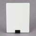 A white card with a black rectangular clip on it.