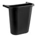 A black Rubbermaid plastic oval wastebasket with a handle.