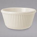 An ivory fluted ramekin on a white background.