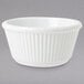 A white bowl with a ribbed pattern.