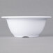 A white Carlisle Sierrus melamine nappie bowl on a gray surface.