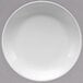 A white porcelain coupe plate with a white rim.