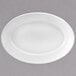 A white oval porcelain platter with a white rim.