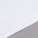 A stack of white Intedge poly/cotton blend square table cloths.