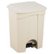 A beige rectangular step-on trash can with a lid and a handle.