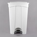 A white Lavex rectangular step-on trash can with a lid.