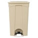 A close-up of a beige Lavex rectangular step-on trash can with a black handle.