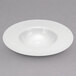 A close up of a white porcelain deep bowl with a rim.