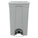 A close-up of a Lavex grey rectangular step-on trash can with a lid.