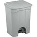 A grey plastic Lavex rectangular step-on trash can with a lid.