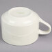 A white Oneida Odyssey cup with a handle.