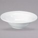 A Oneida Espree cream white china bowl with a curved edge.