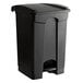 A Lavex black rectangular step-on trash can with a lid.