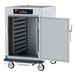 A large metal Metro C5 heated holding cabinet with a door open.