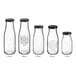A row of clear Acopa glass milk bottles with black lids.