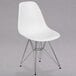 A Flash Furniture white plastic chair with metal legs.