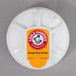 An Arm & Hammer Fridge Fresh refrigerator air filter in white packaging with a round label.