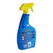 A blue OxiClean spray bottle with a yellow handle.