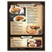 A Menu Solutions customizable menu board on a table with a pizza and french fries.