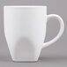 A Tuxton white china mug with a handle.