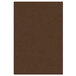 A brown hardboard surface with a white border.