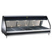 An Alto-Shaam heated display case with a glass door and top on a counter.