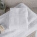 A stack of Oxford Vicenza Bianco white wash cloths on a counter.