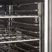 A stainless steel oven rack in a Cooking Performance Group double deck electric convection oven.