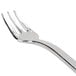 A close-up of a Fineline silver plastic tasting fork with a silver handle.