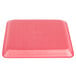 A pink CKF foam meat tray with a lid on it.