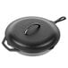 A black Lodge cast iron skillet with a handle and lid.