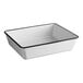 A white rectangular melamine serving bowl with black trim.