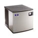 A silver and black Manitowoc IYT0420W-161 water cooled ice machine.