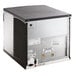 A white Manitowoc water cooled ice machine with a black square cover.
